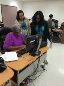 Students help participant understand how to use Microsoft Word.